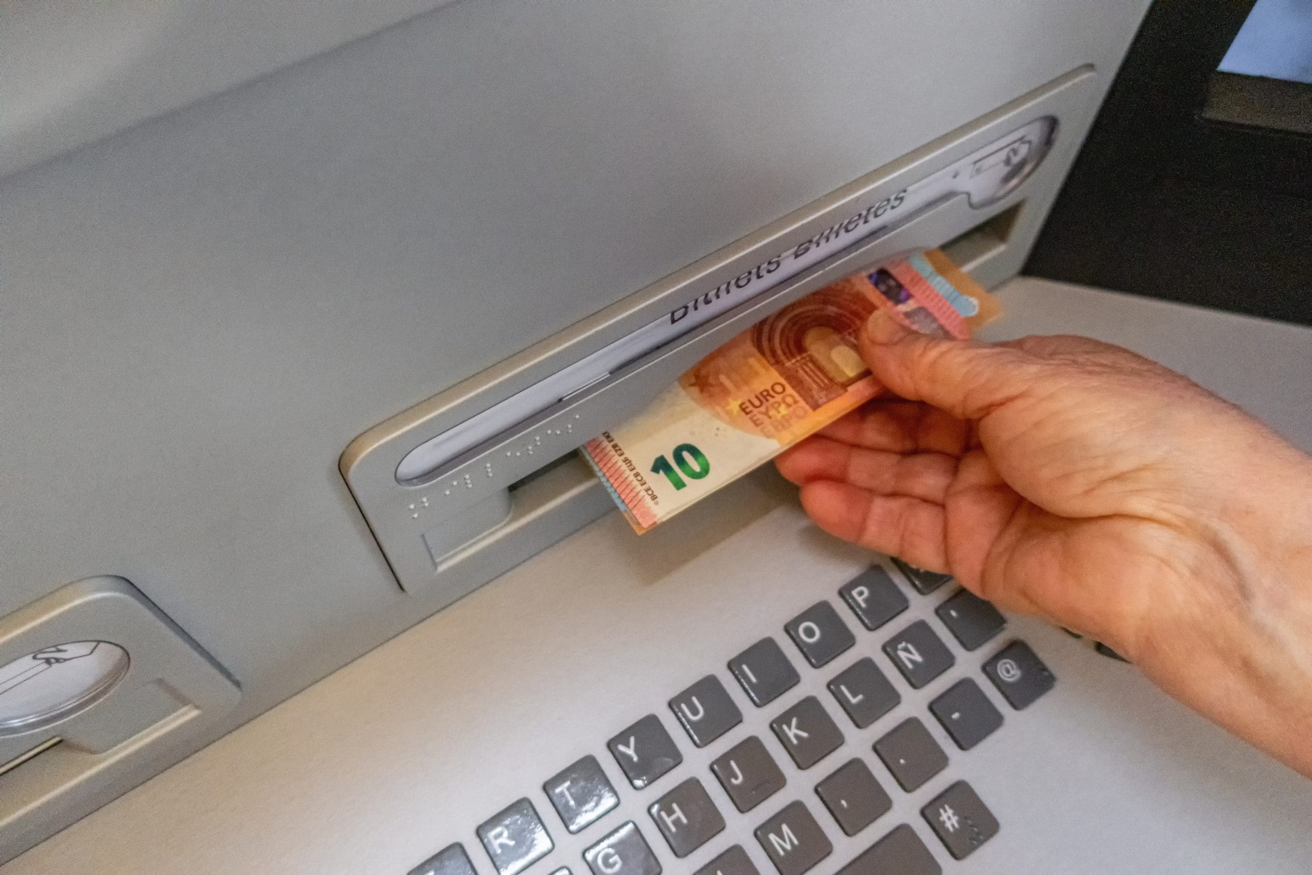 hand taking money from a