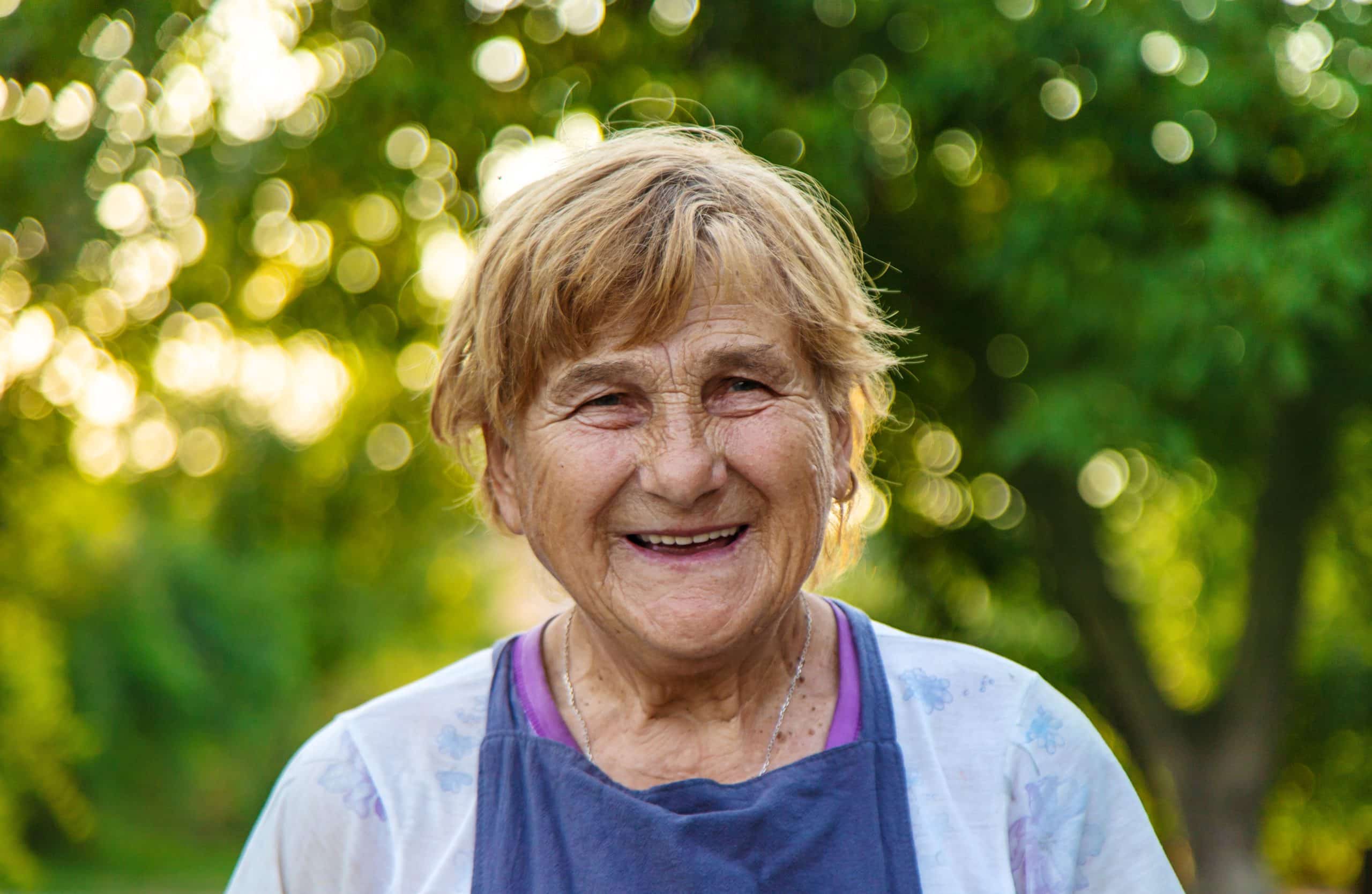 elderly woman portrait in the garden. selective focus.
